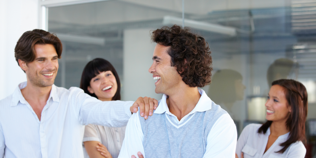 happy colleagues enjoying workplace wellness