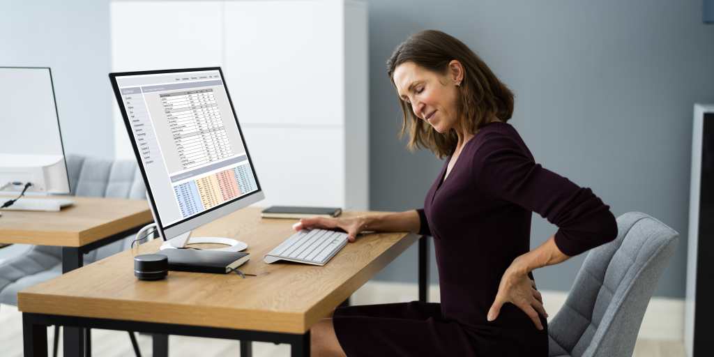 lady at office desk with back pain